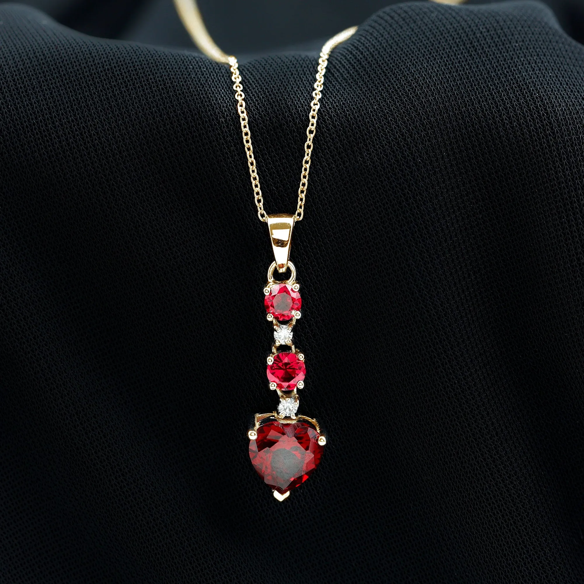 Created Ruby and Moissanite Heart Dangle Pendant Necklace