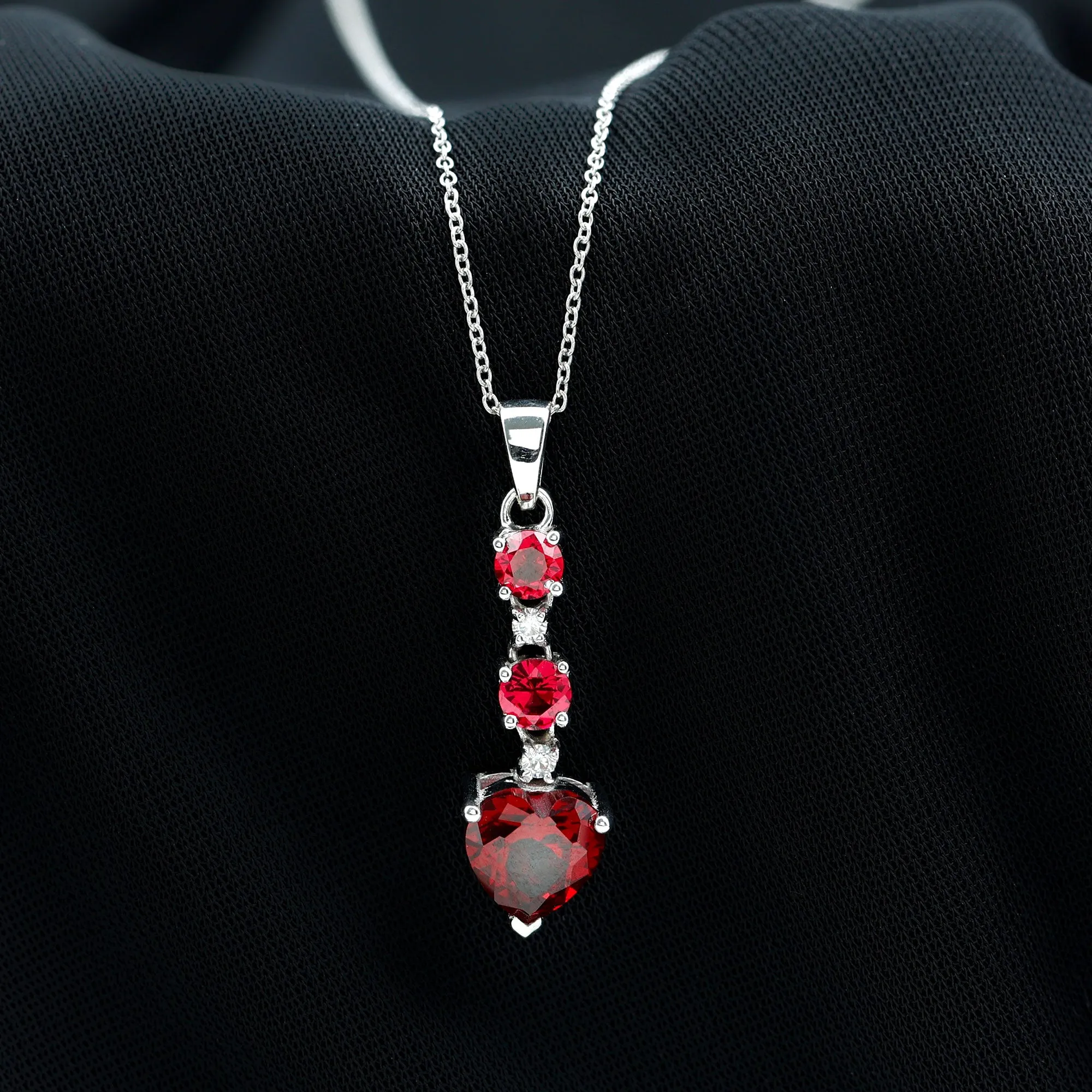 Created Ruby and Moissanite Heart Dangle Pendant Necklace