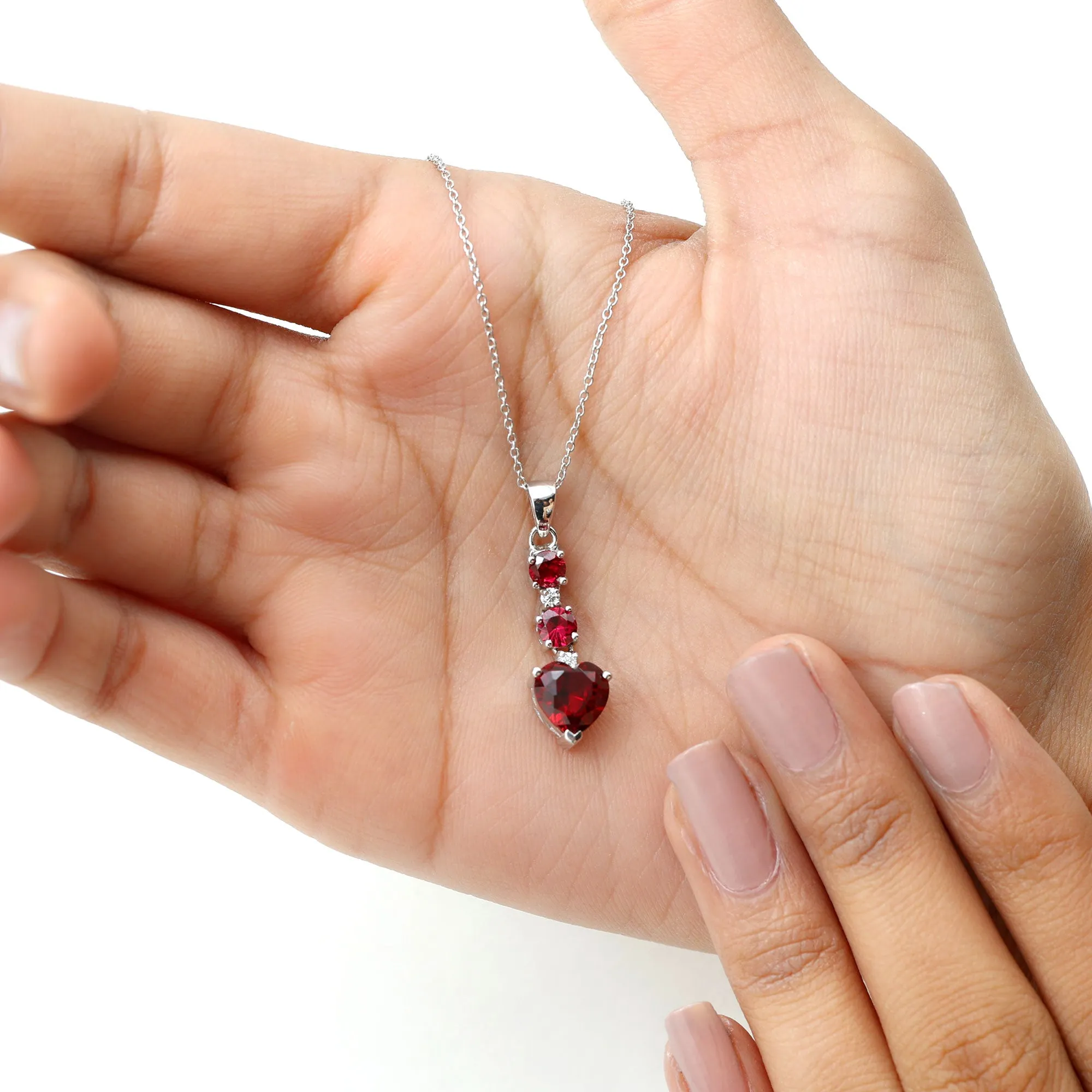 Created Ruby and Moissanite Heart Dangle Pendant Necklace