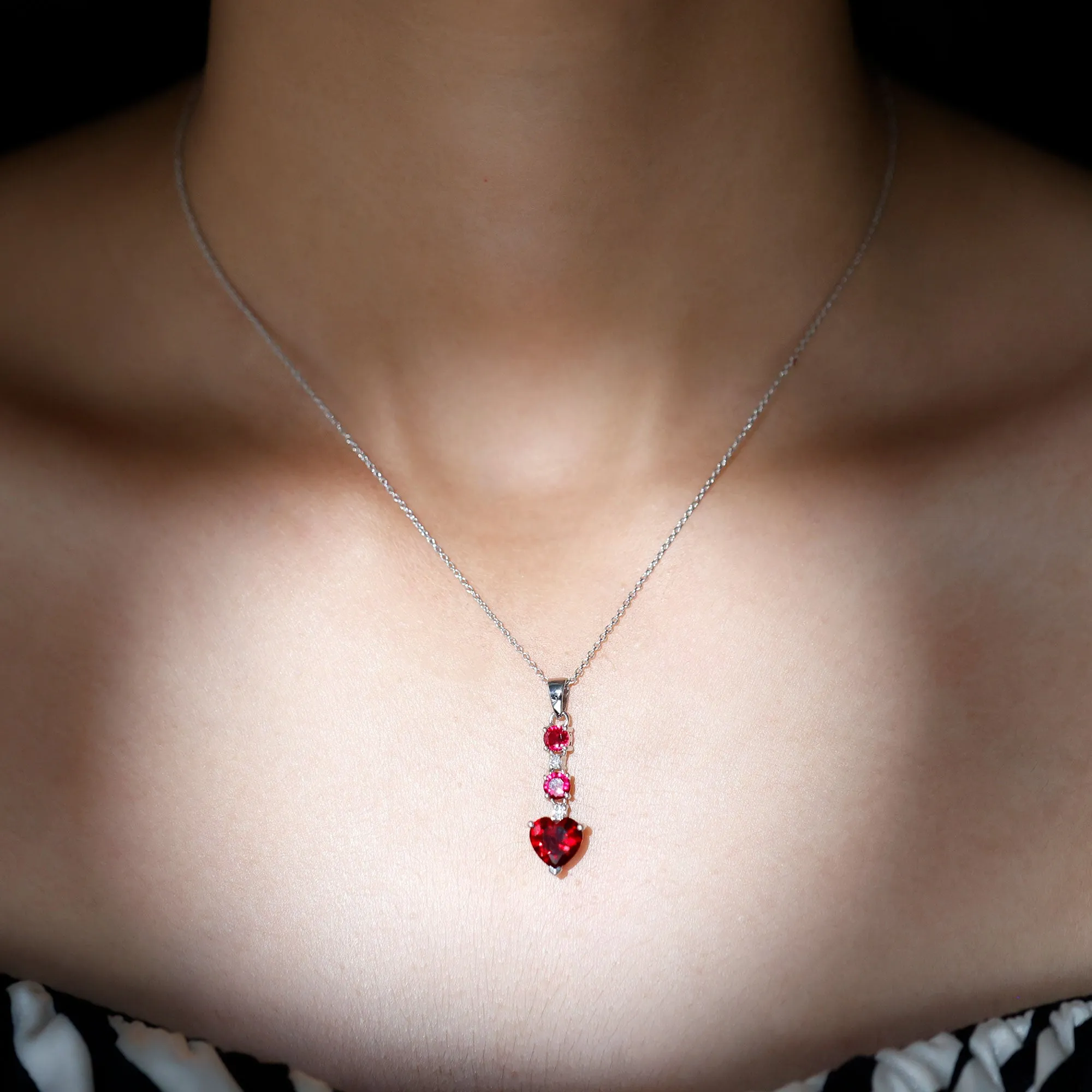 Created Ruby and Moissanite Heart Dangle Pendant Necklace