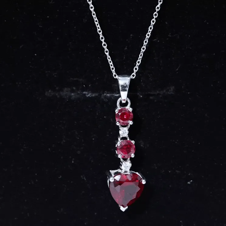 Created Ruby and Moissanite Heart Dangle Pendant Necklace