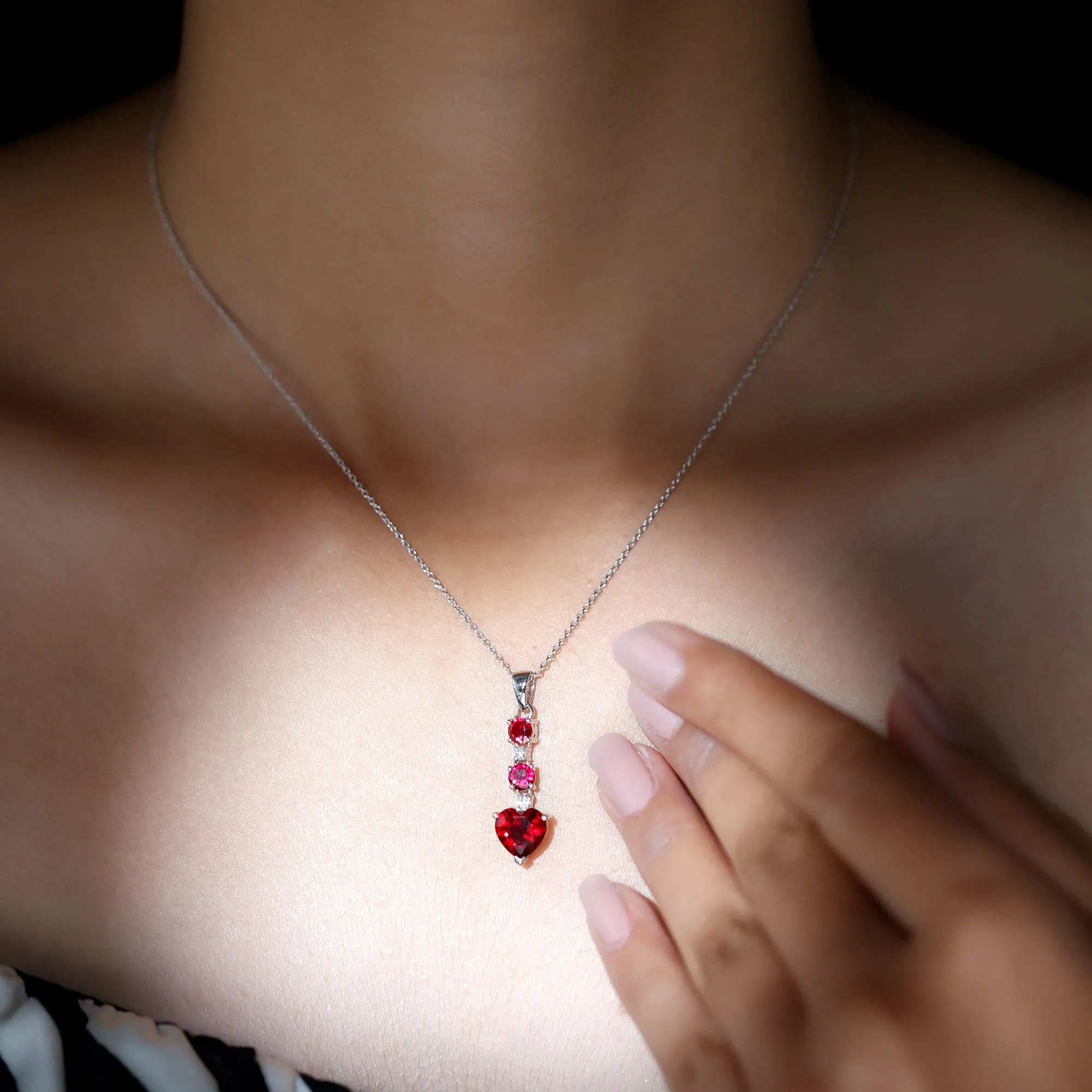 Created Ruby and Moissanite Heart Dangle Pendant Necklace
